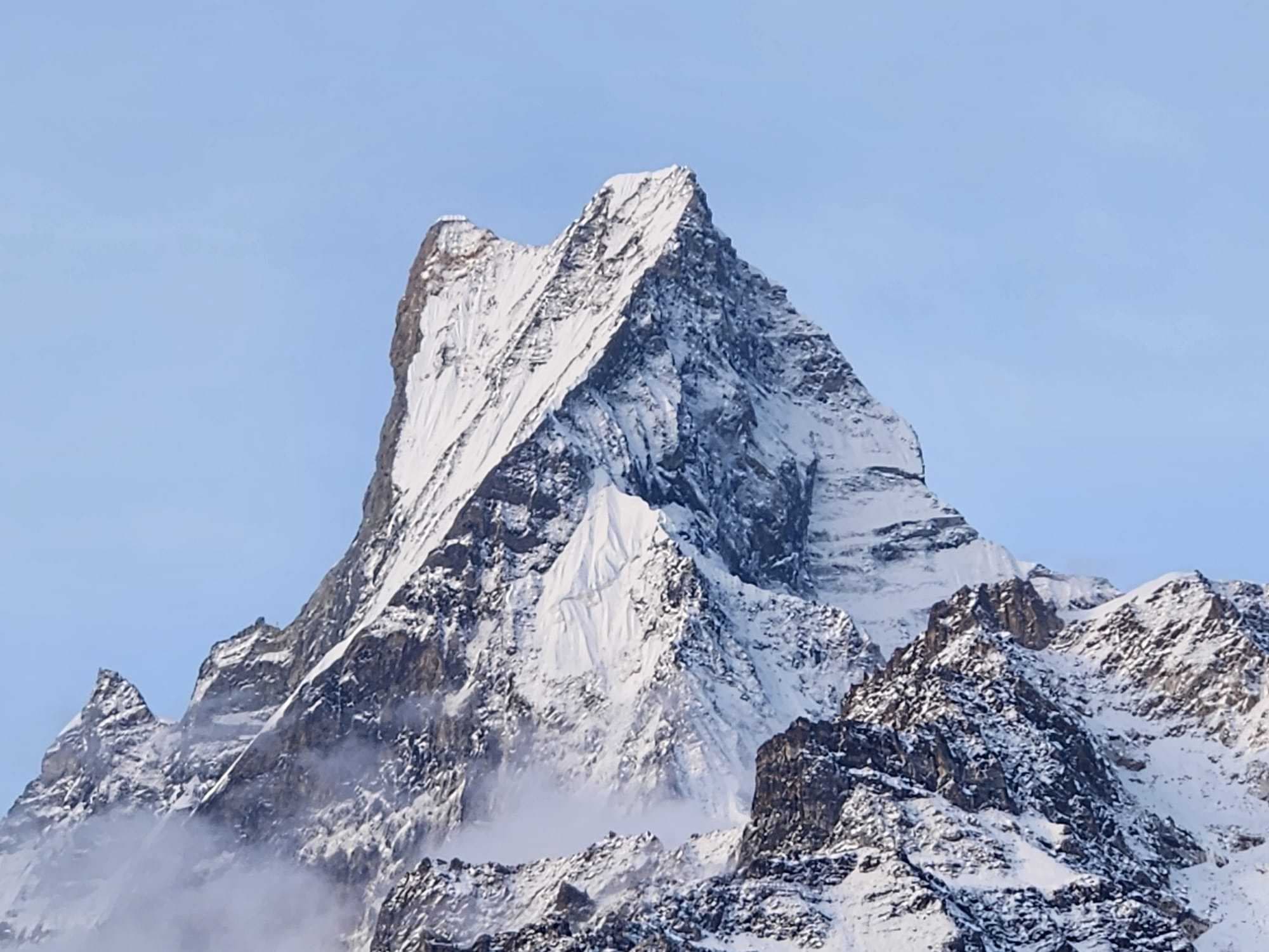 now-capped peaks of Annapurna reflected in a high-altitude lake
