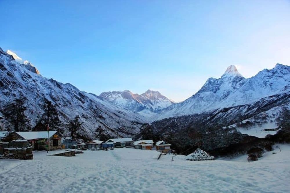 Snowy Everest Base Camp trek trail in Nepal during winter with Himalayan peaks