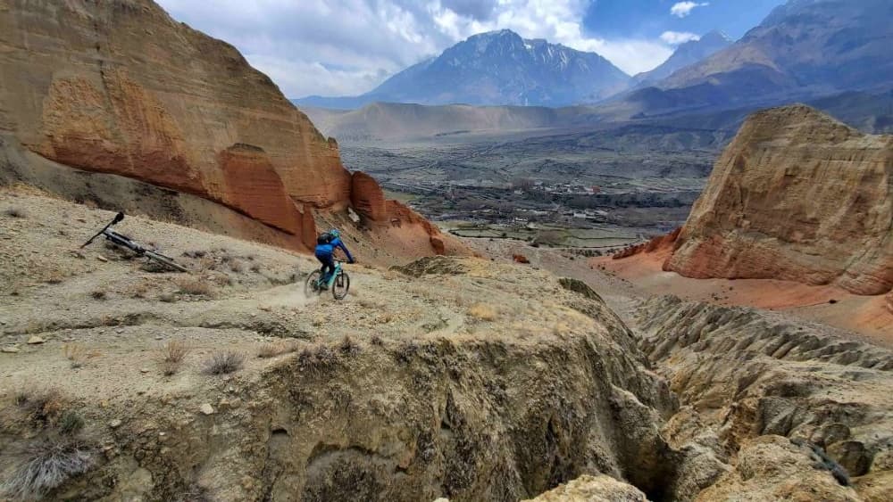 Mountain biker riding on a scenic trail in Nepal